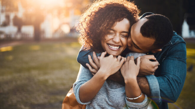 Shot of an affectionate young couple bonding together outdoors