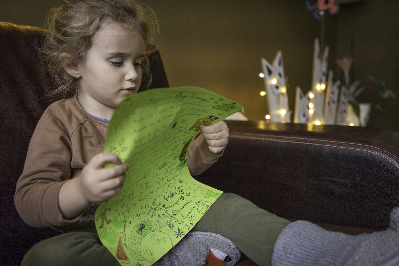 Kid reading a letter