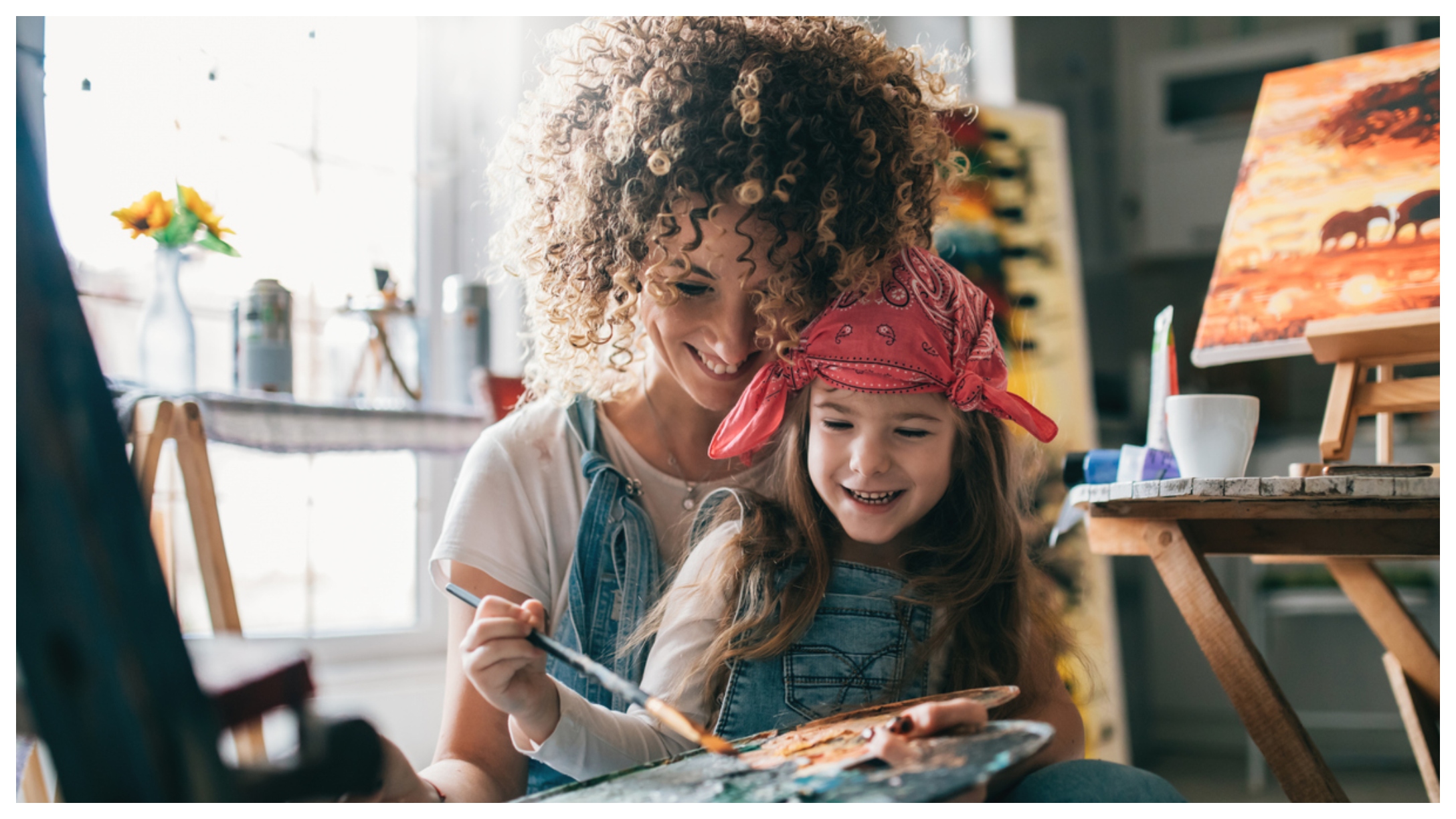 mom and daughter painting together