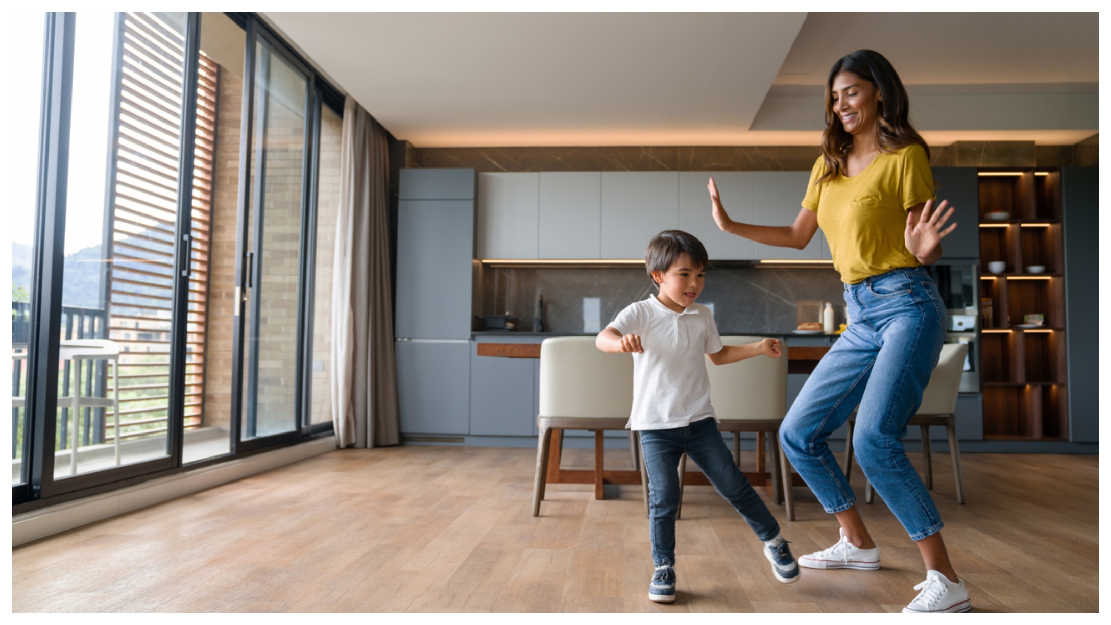 mom and son dancing at home