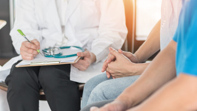 Patient couple consulting with doctor or psychologist on marriage counseling, family medical healthcare therapy, In vitro fertility IVF treatment for infertility, or psychotherapy session concept