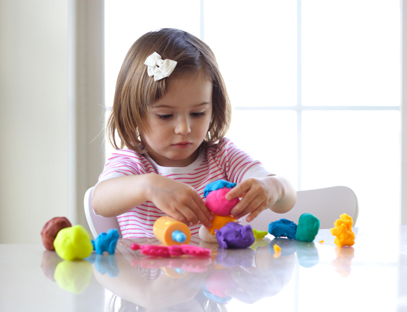 Girl playing with play dough