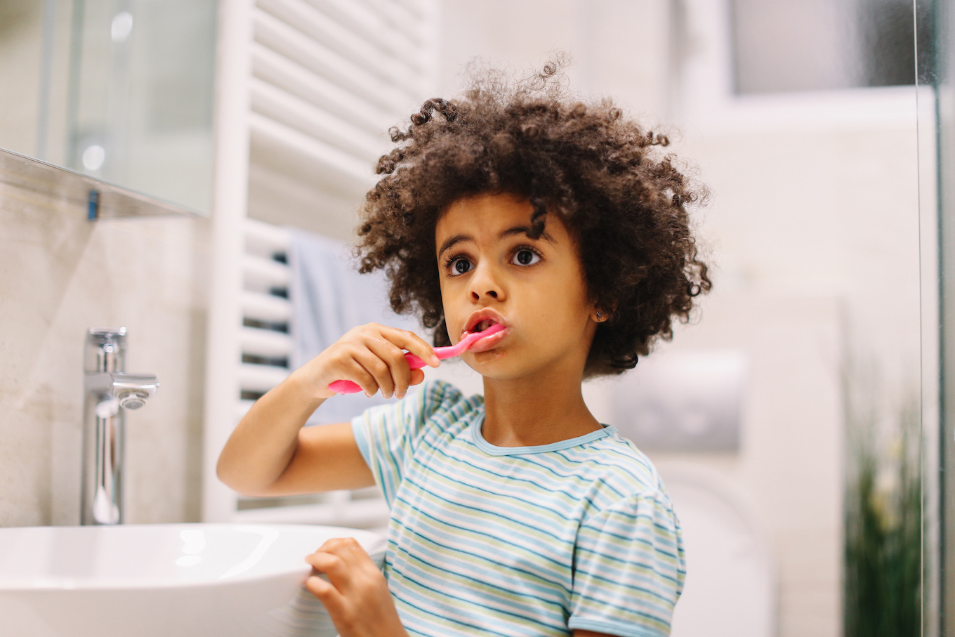 Kid brushing teeth