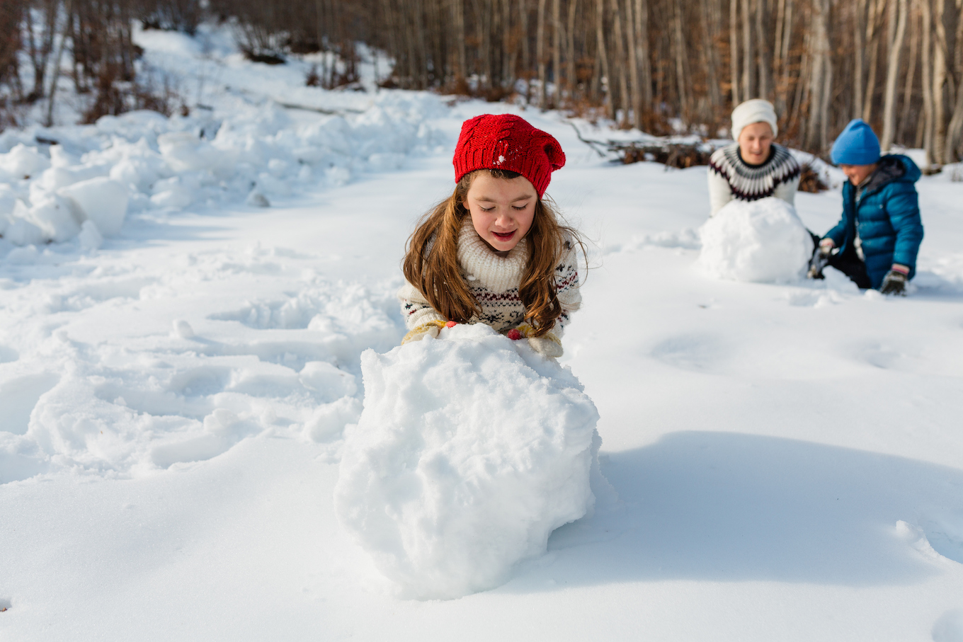 Kids building a snowman