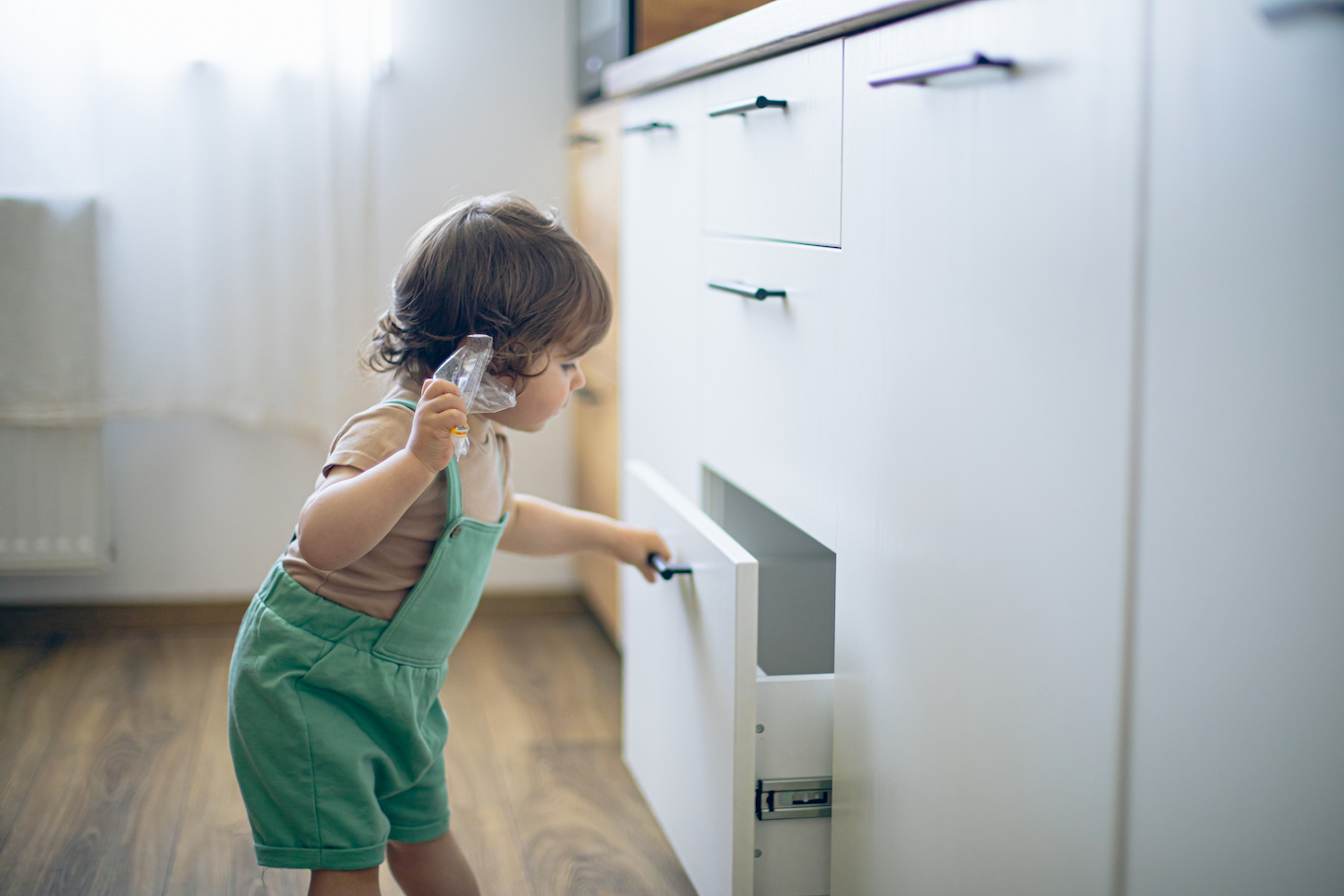 Baby looking in drawer