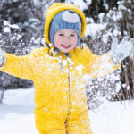 Child playing in the snow