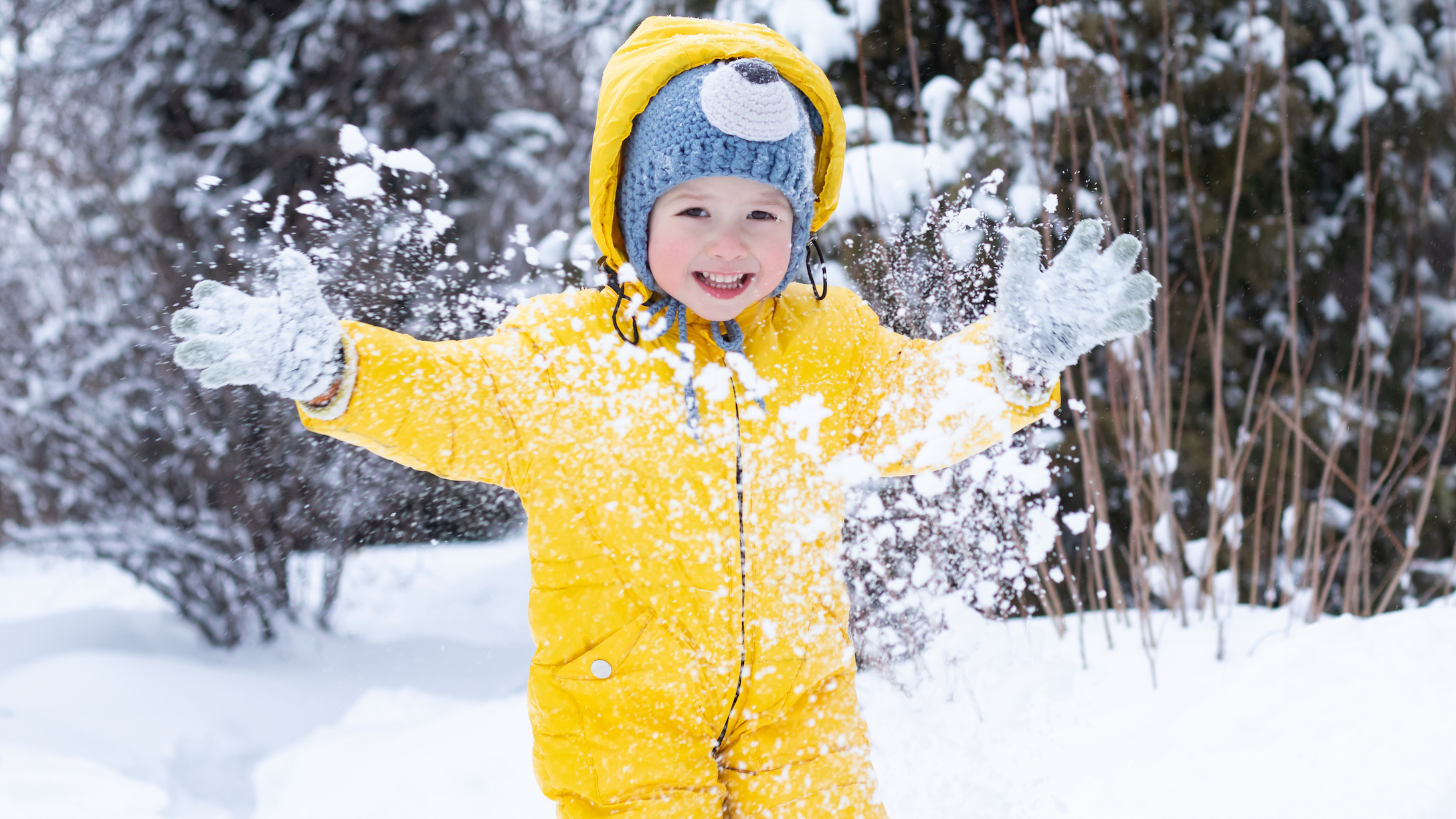 Child playing in the snow