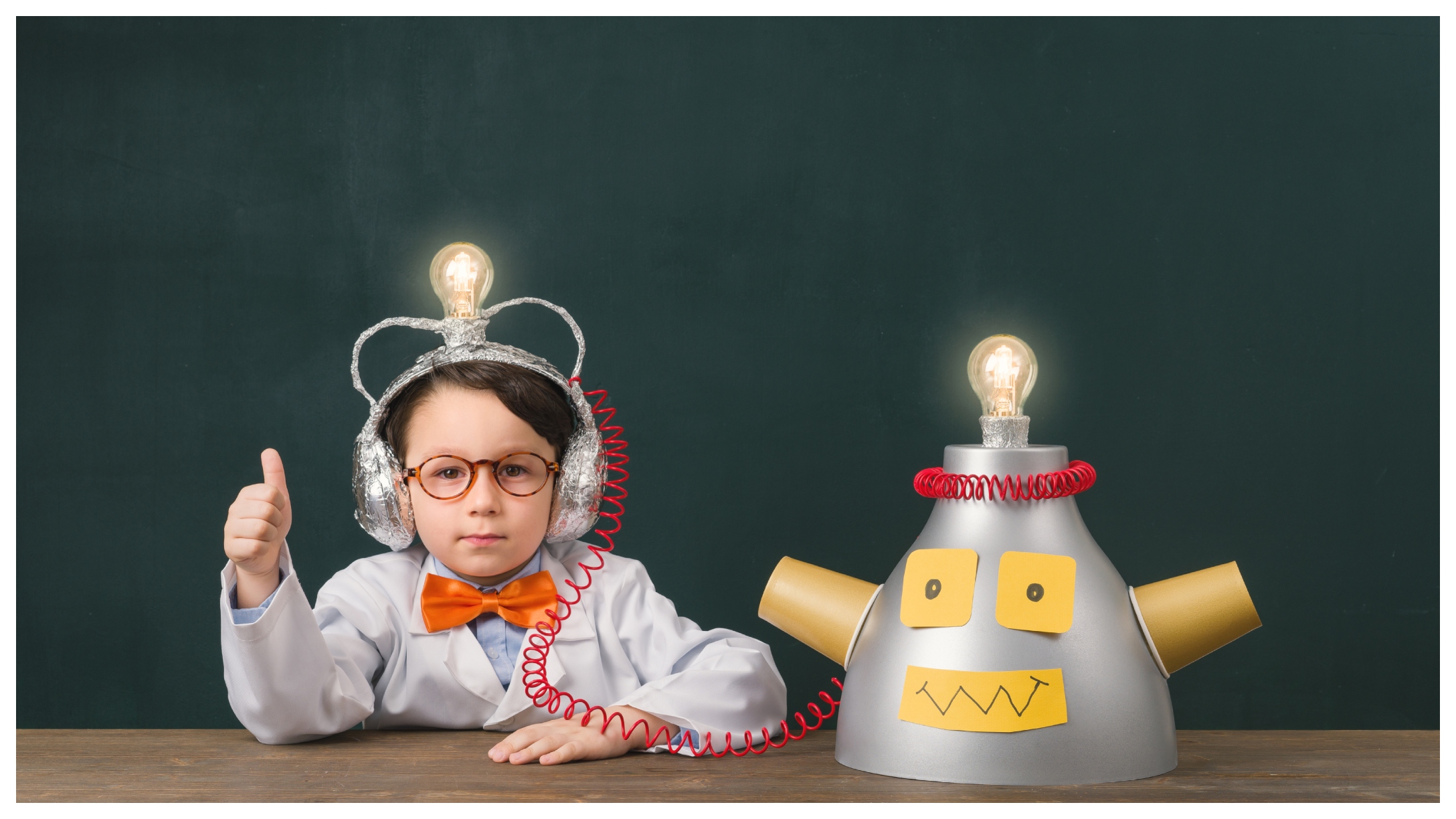 young boy with robot creation