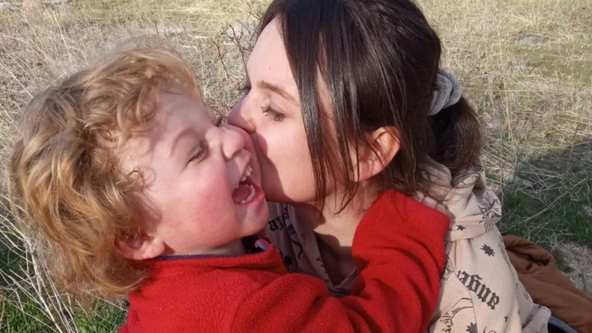 Chandler Johnson laughing with his mom Gabryelle Johnson