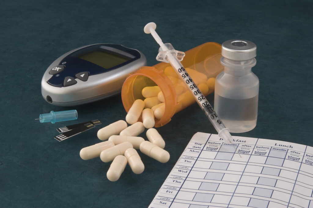 Photograph of various diabetic tools and medicine.