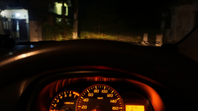 car speedometer and windshield facing outdoor wall