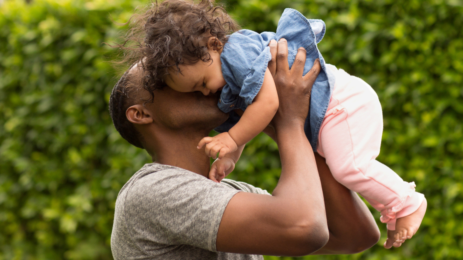 dad holding baby daughter