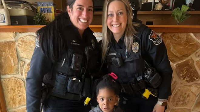 Mount Pleasant police officers with four-year-old boy