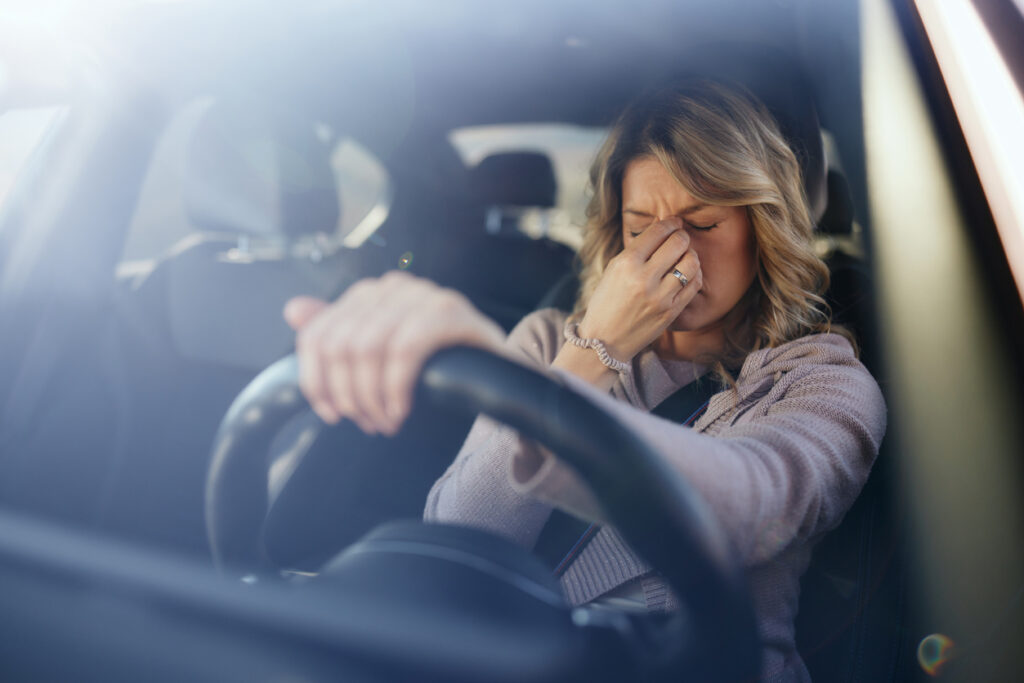 woman stressed out in car