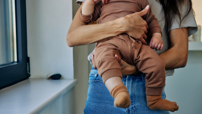 mom holding baby