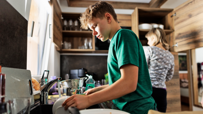 teen doing dishes