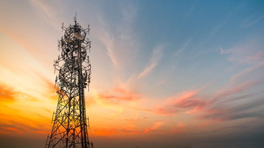 5G Sunset Cell Tower: Cellular communications tower for mobile phone and video data transmission