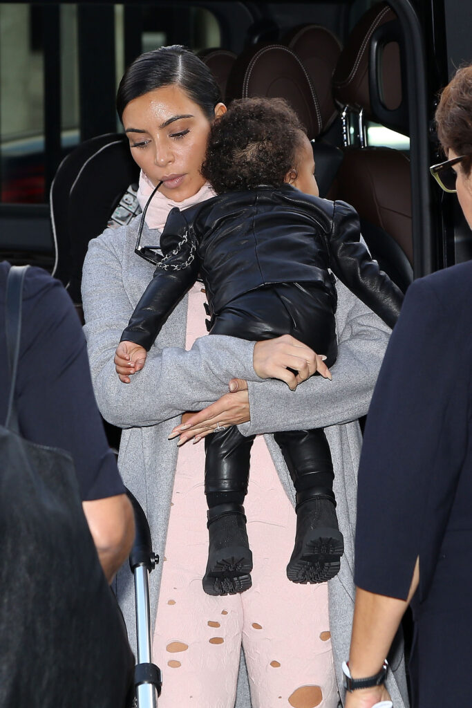 PARIS, FRANCE - OCTOBER 01: Kim Kardashian and North West arrive at Charles-de-Gaulle airport on October 1, 2014 in Paris, France. (Photo by Marc Piasecki/GC Images)