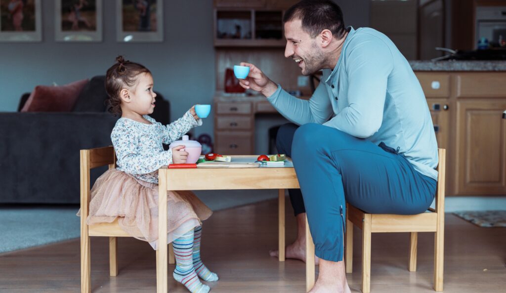 father and daughter playing