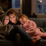 mom with kids under blanket