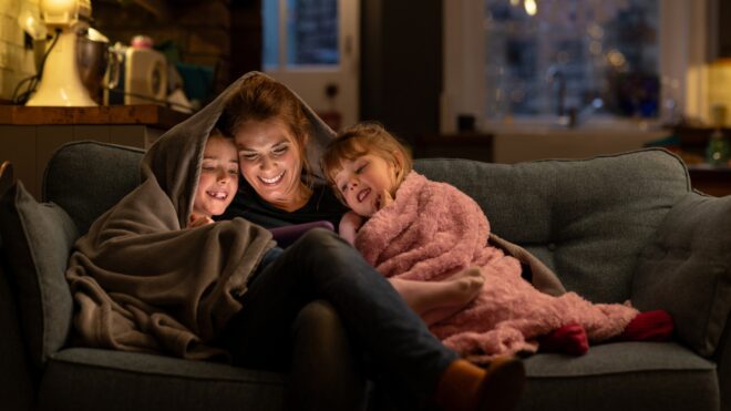 mom with kids under blanket