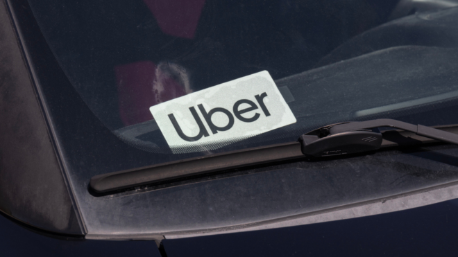 car windshield with white Uber sticker