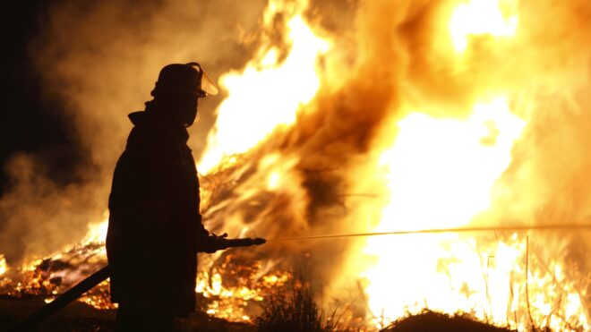 firefighter fighting wildfire