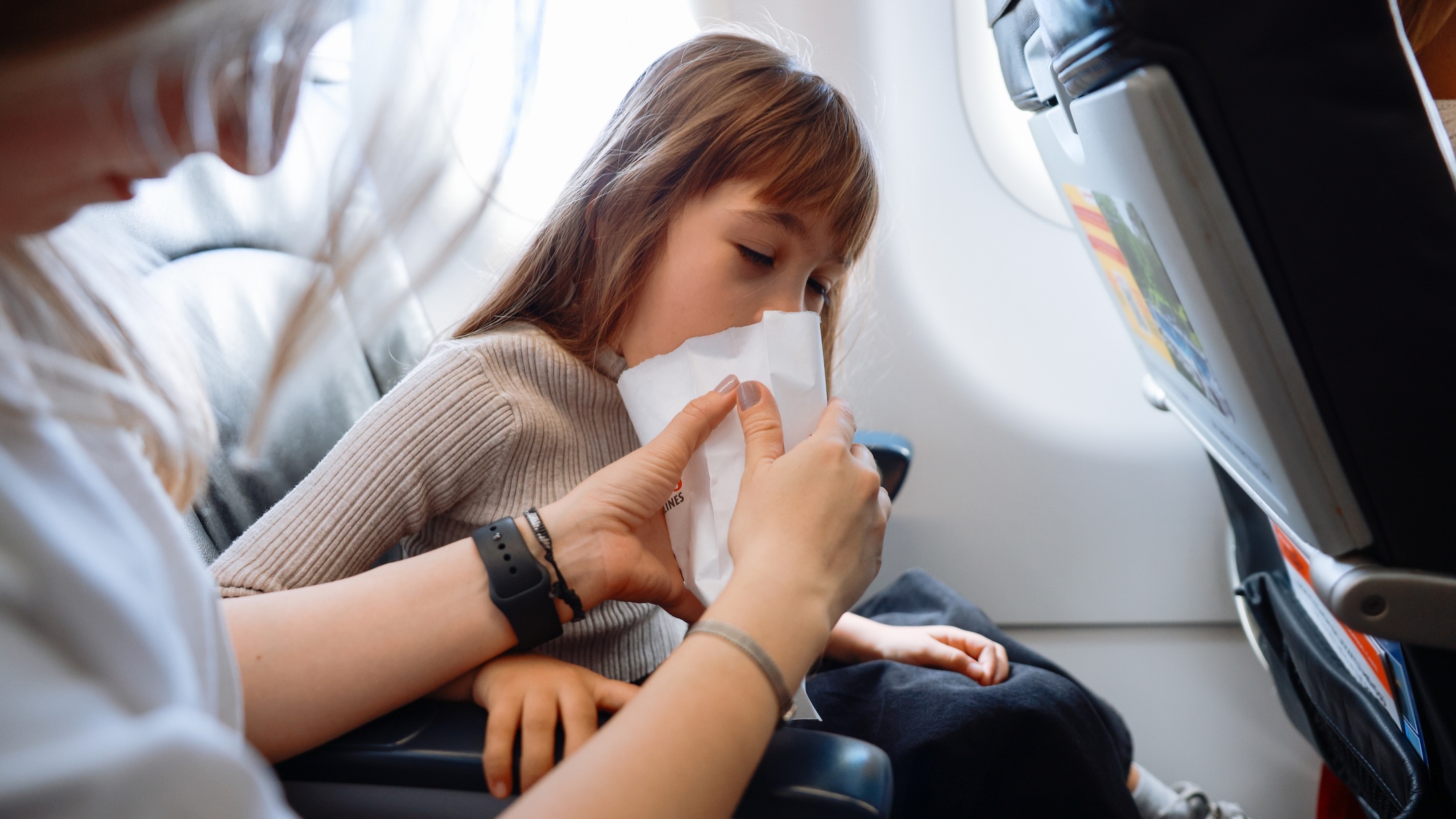 sick girl on plane
