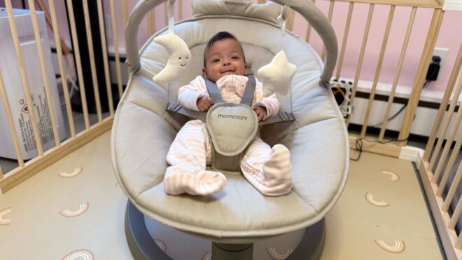baby in momcozy baby swing