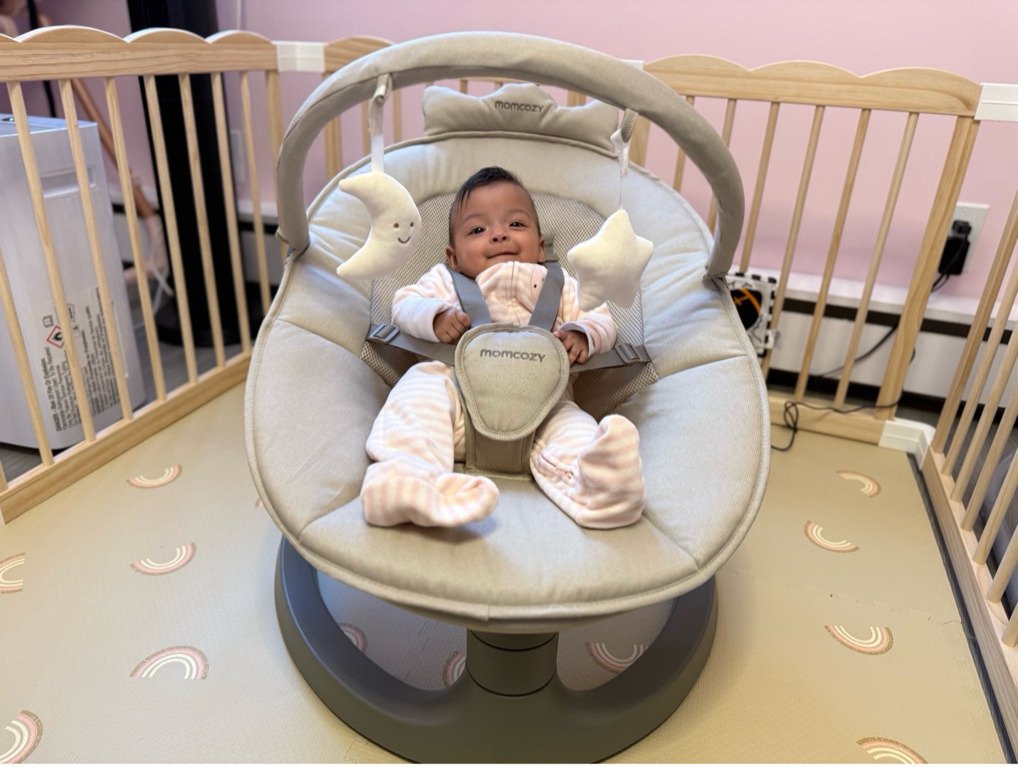 baby in momcozy baby swing