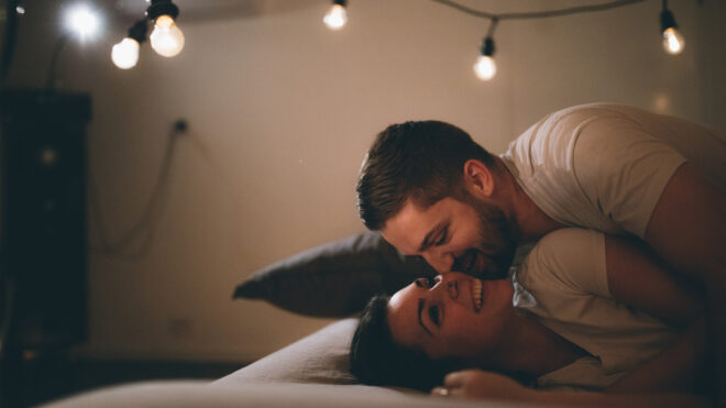 couple in bed with lights