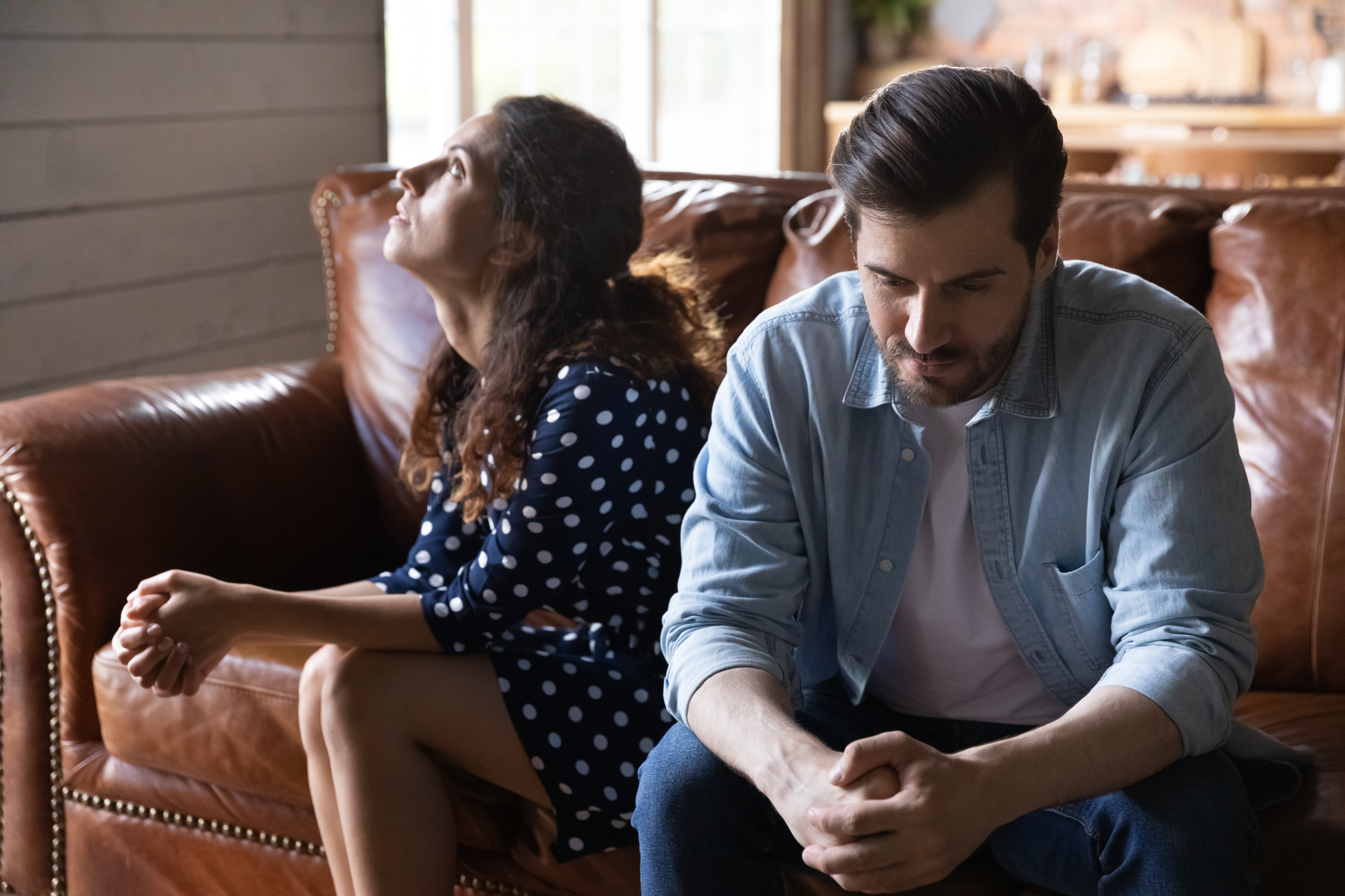 Young married couple going through relationship problems unhappy couple