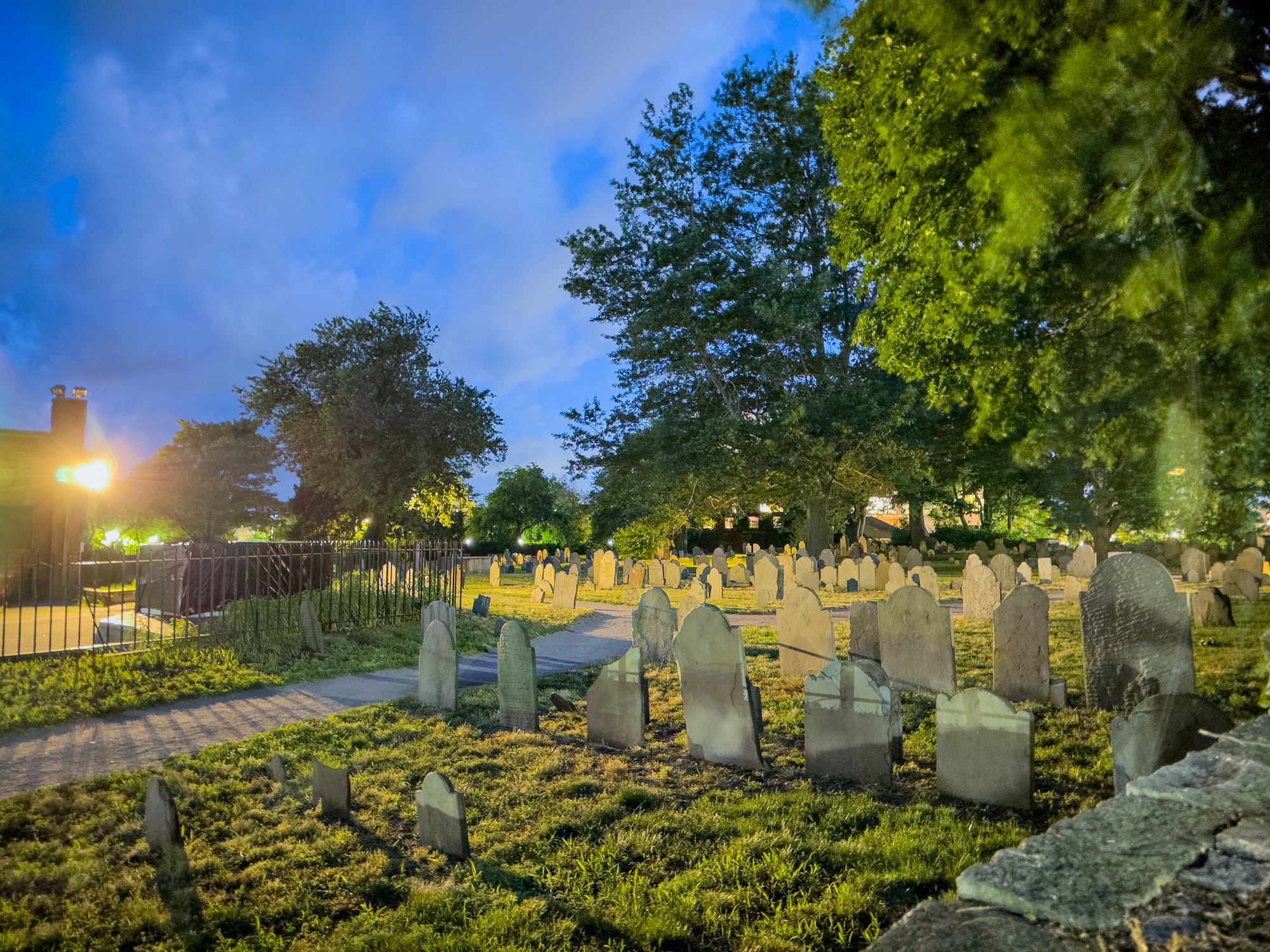 Salem, Massachusetts, USA. Night photo of a haunted grave yard with buried witches