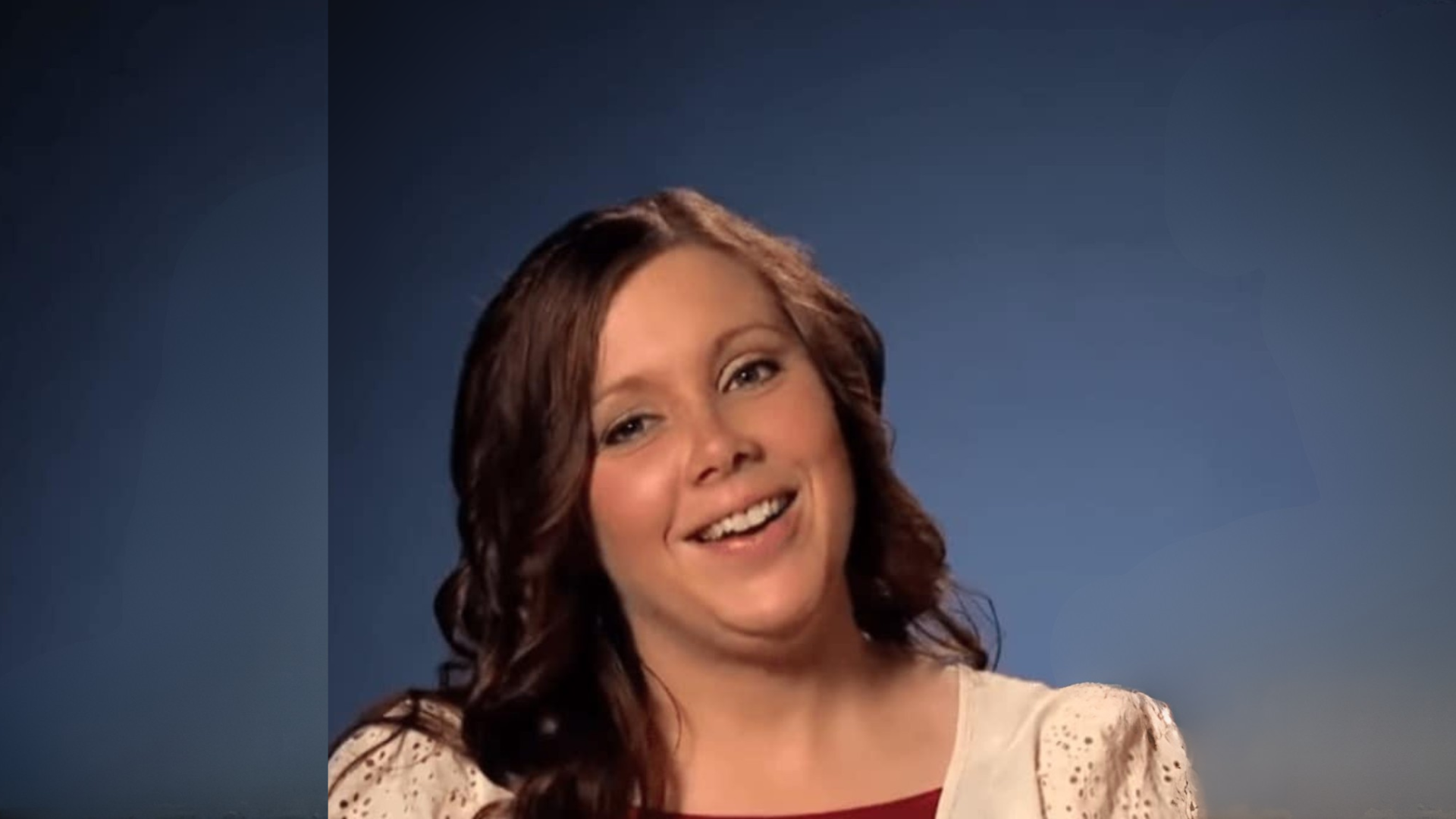 Anna Duggar on blue background