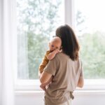 mom holding baby in her arms