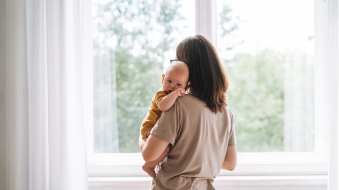 mom holding baby in her arms