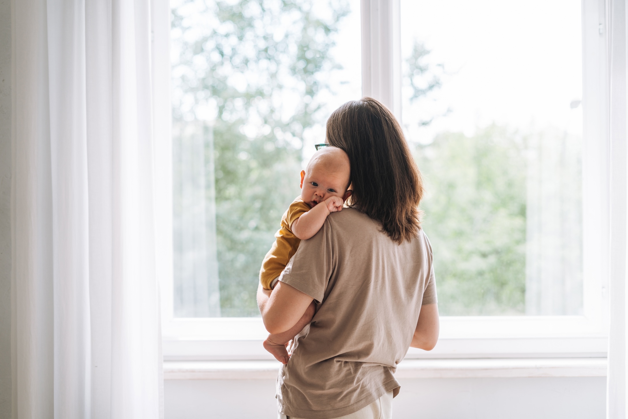 mom holding baby in her arms