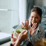 woman refusing salad