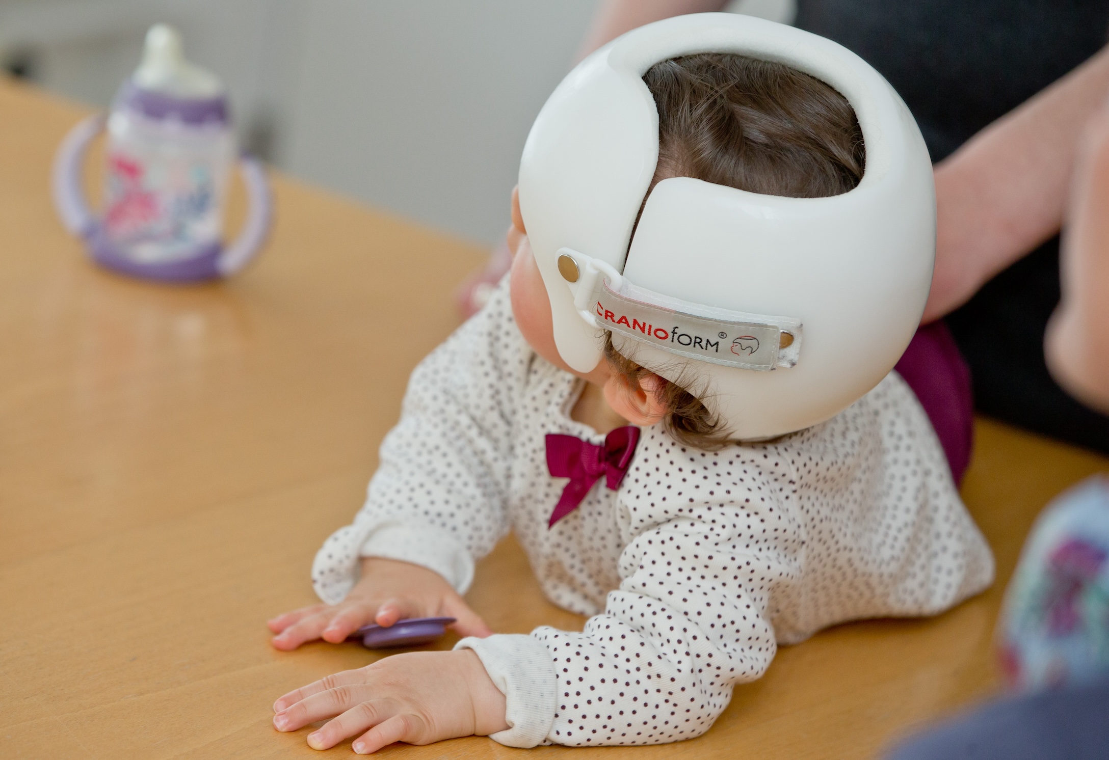 baby girl in a helmet