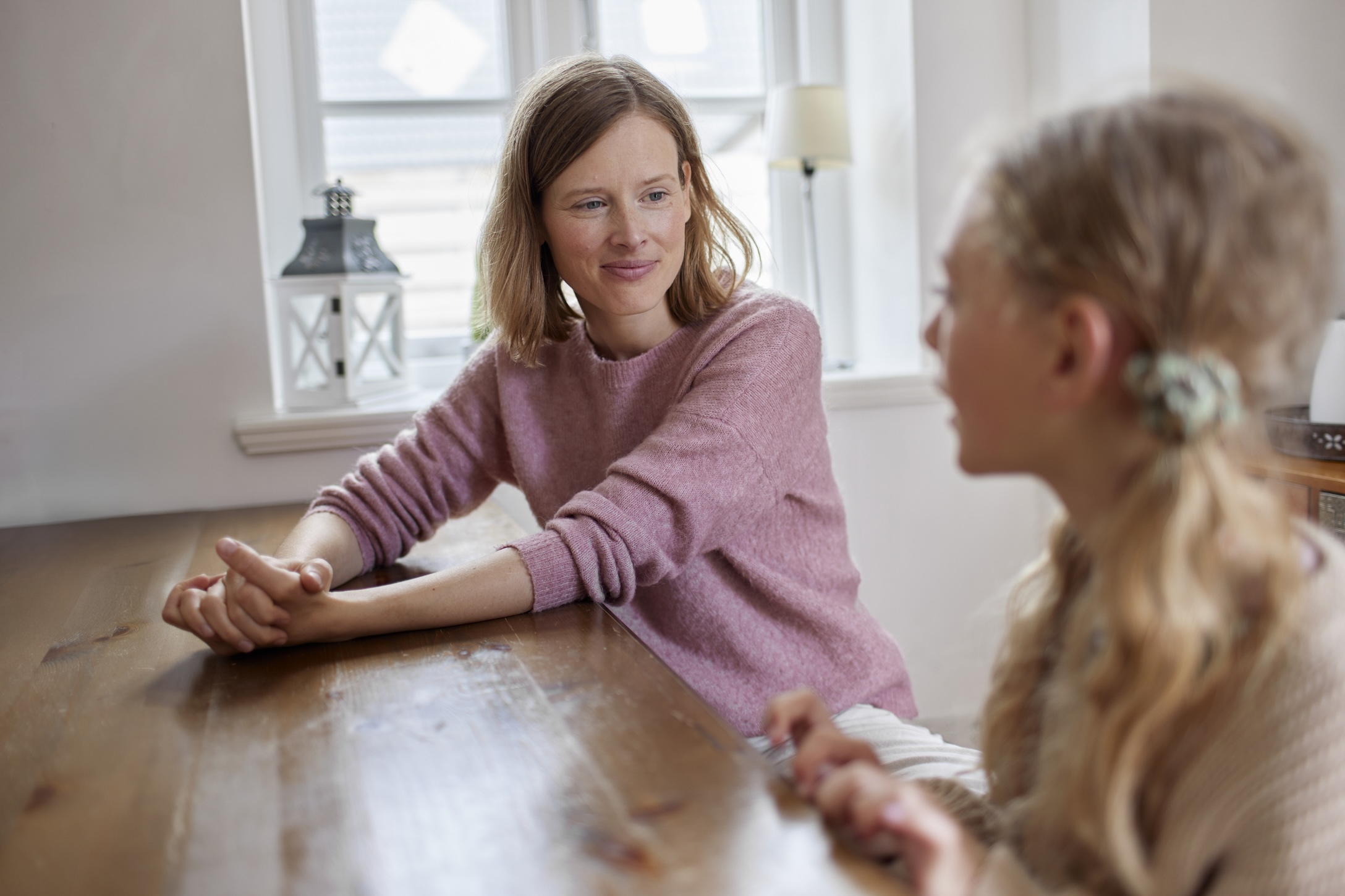 a mom and daughter talking