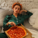 pretty female in pajamas self-isolated at home