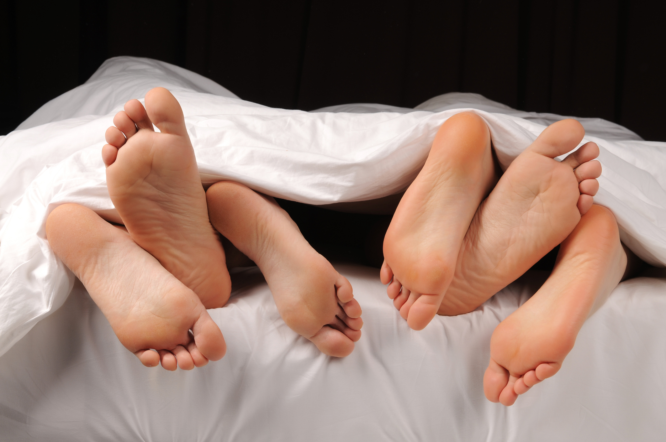 feet on the bed threesome