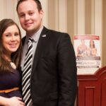 Anna and Josh Duggar posing together in formal wear