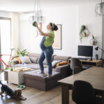 Expecting woman cleaning up before baby arrival.