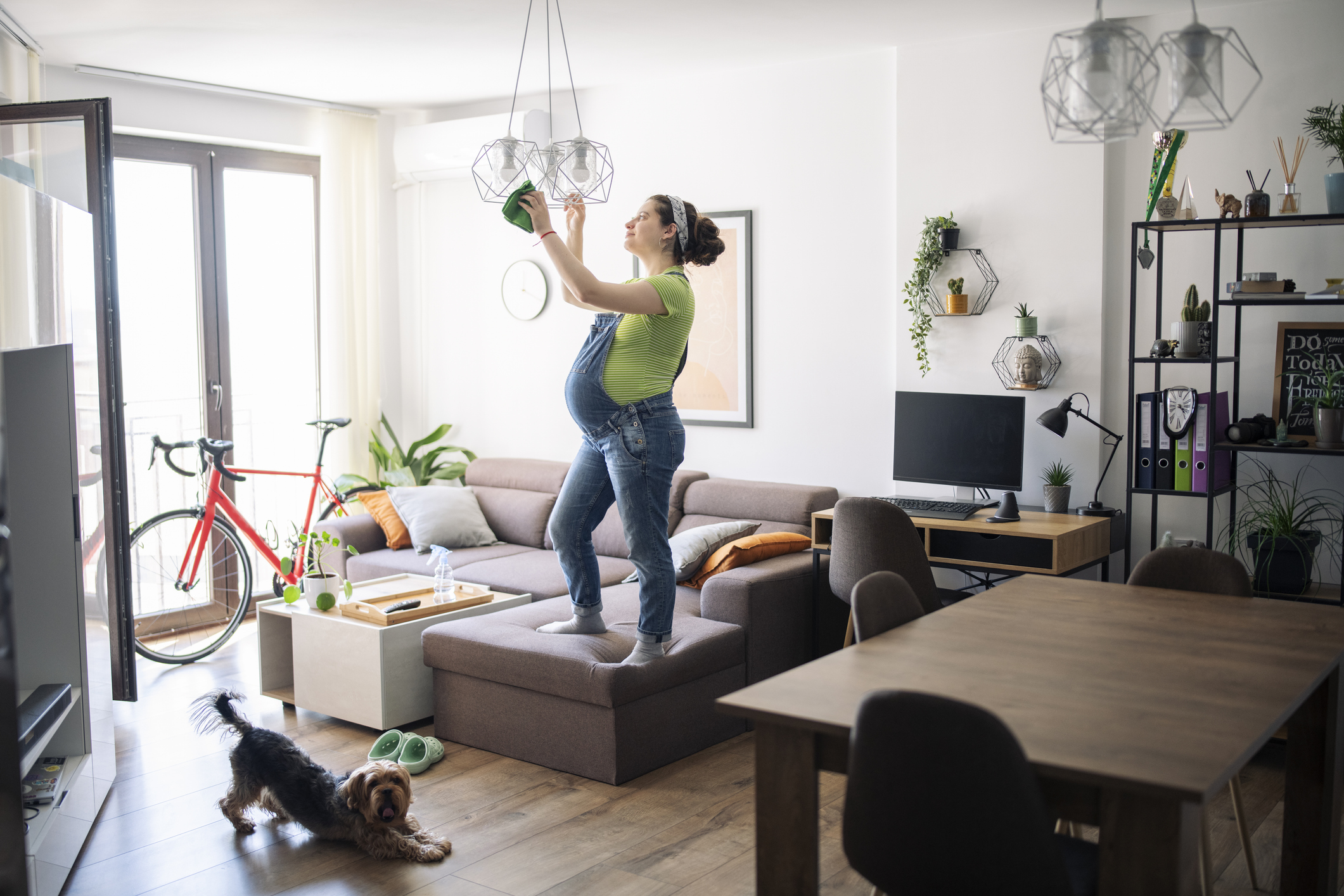 Expecting woman cleaning up before baby arrival.