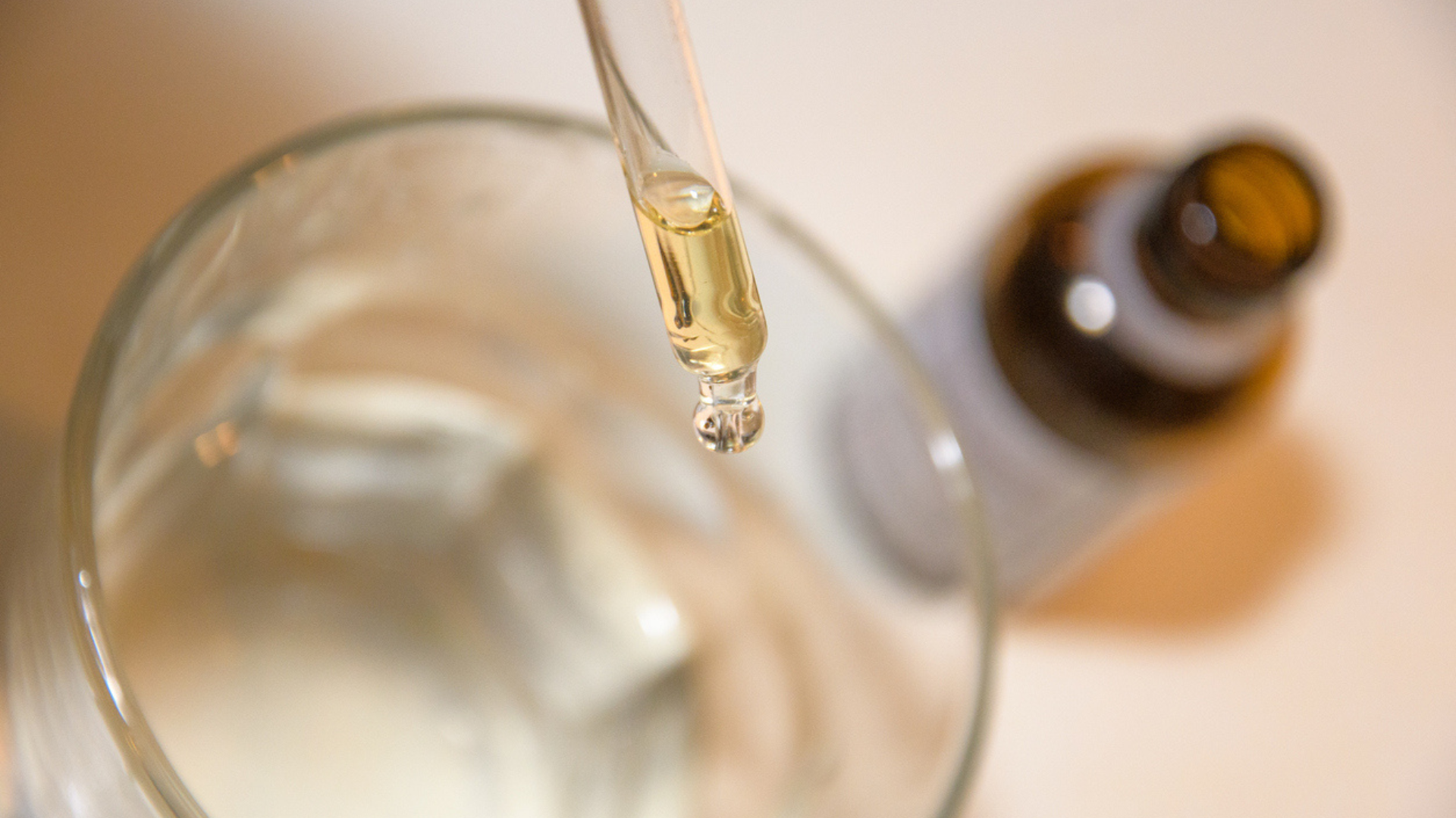 liquid medication dropped into water glass