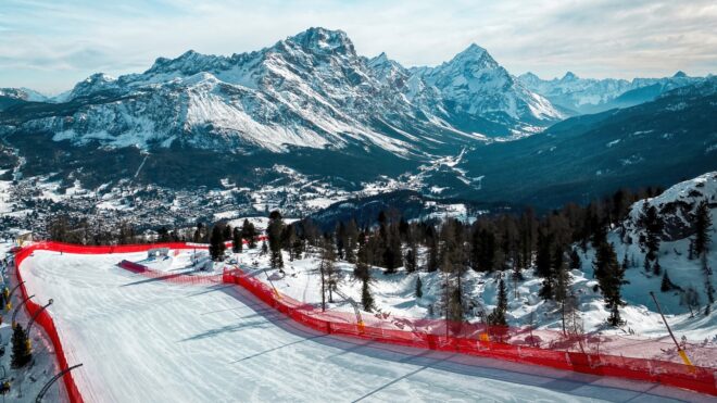 Scenic view of Tofana ski racing slope in Cortina d'Ampezzo in Italy against snow covered Punta Sorapiss Mountain (middle) and Antelao (right)