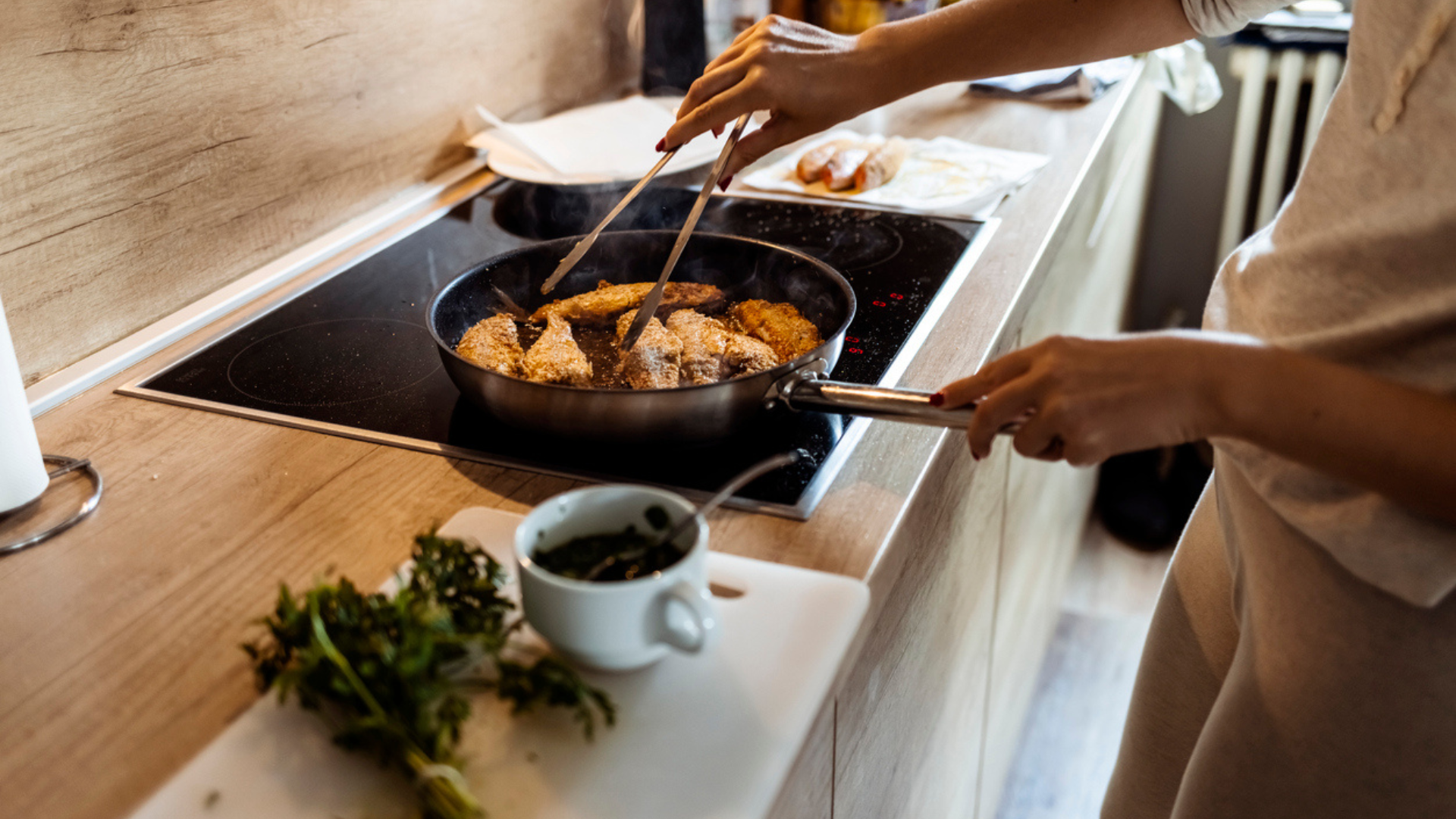 woman making dinner on stove