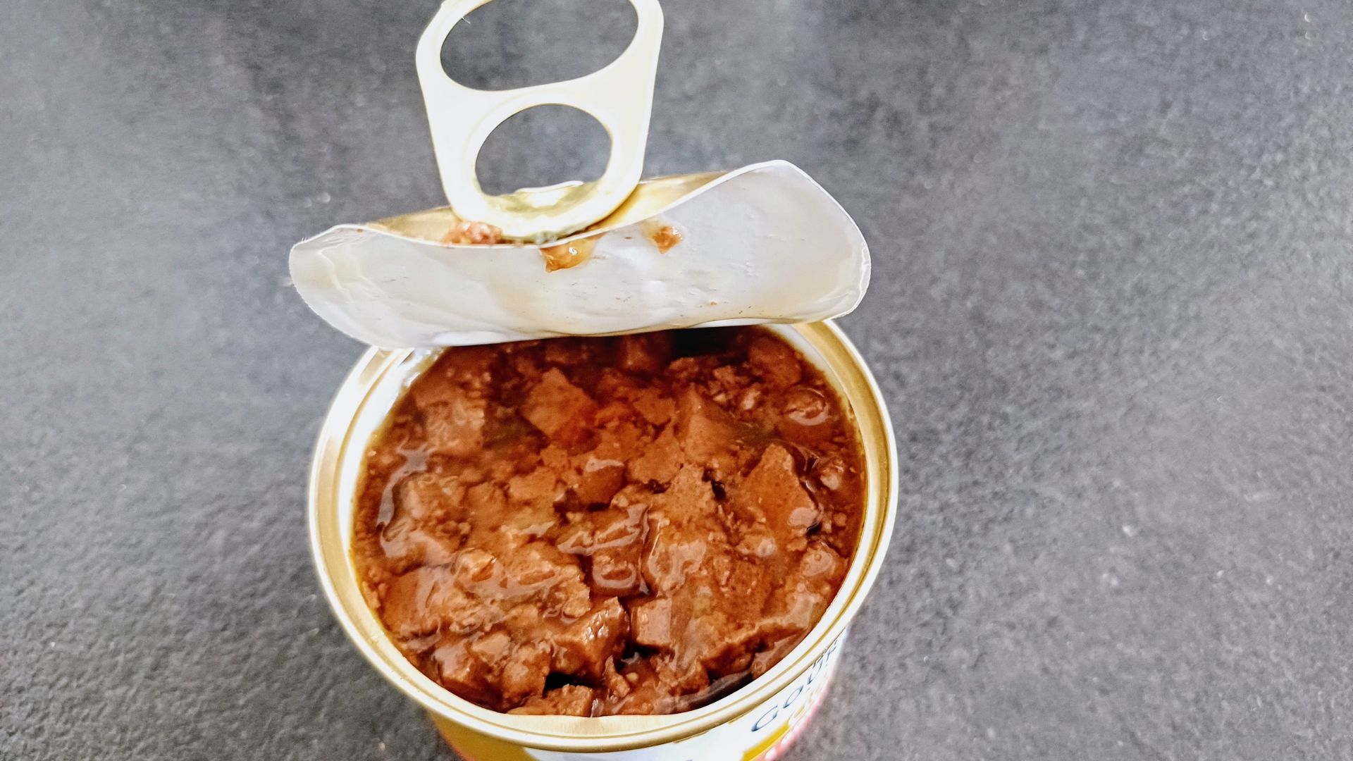 A can of opened dog food