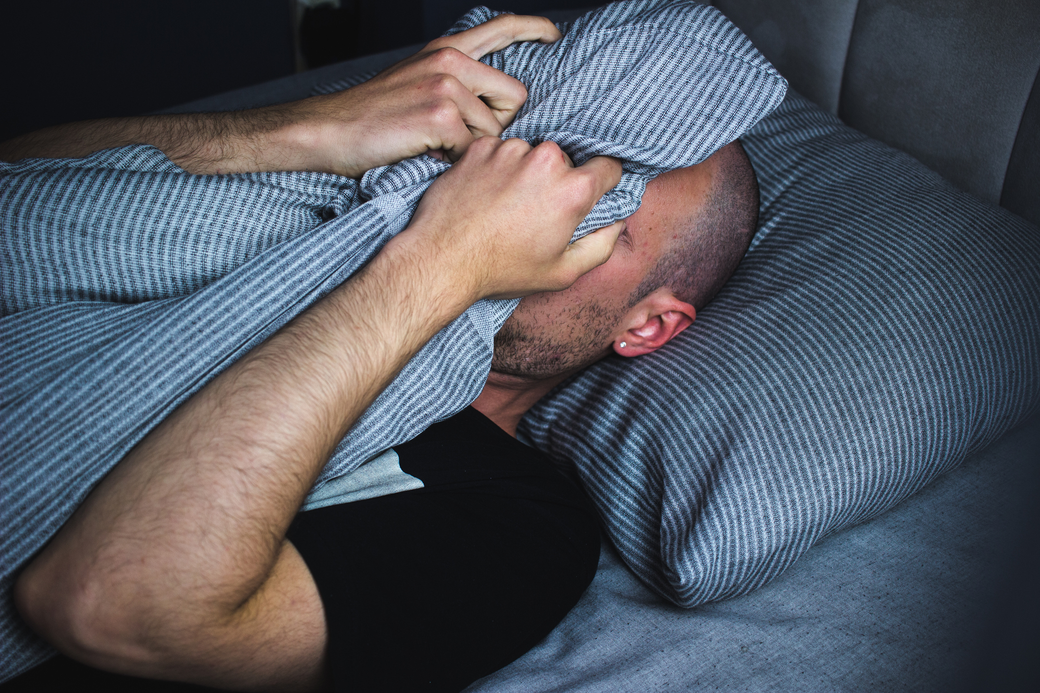 Photo showing young adult male with sleep problems